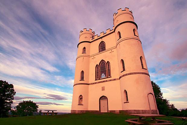 Castle bathed in red light at sunset