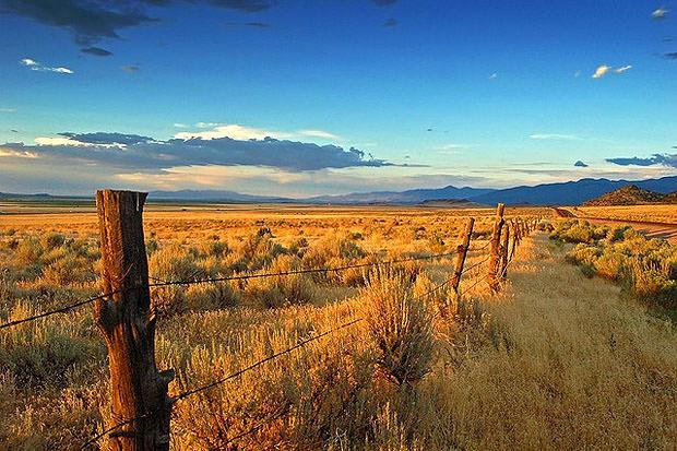 Fence and landscape at sunset