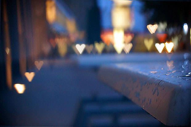 Outdoor dining table with heart lights behind