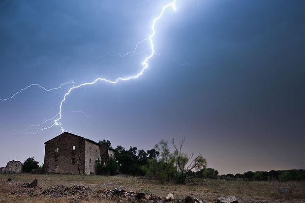 Lightning striking a house