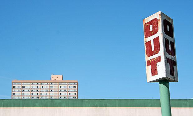 Road sign with building behind