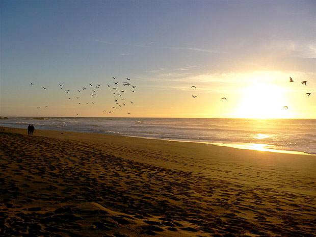 Beach scene with bright sky and dark ground