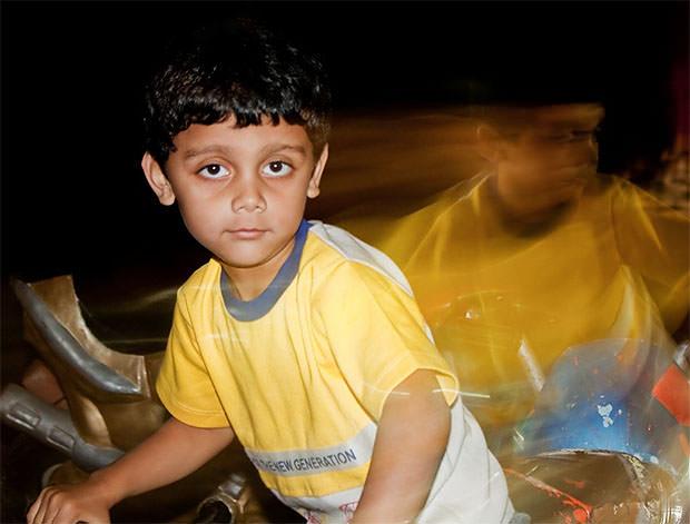 A boy on bike at night