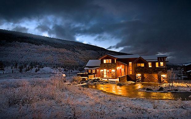 House in snow at night