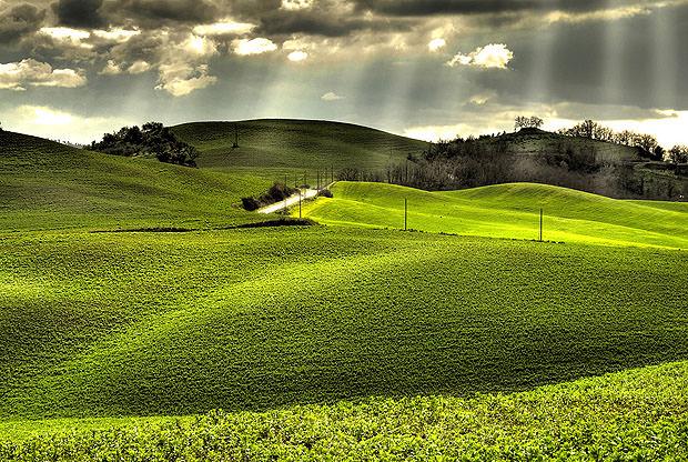 Sunlit landscape with broody sky